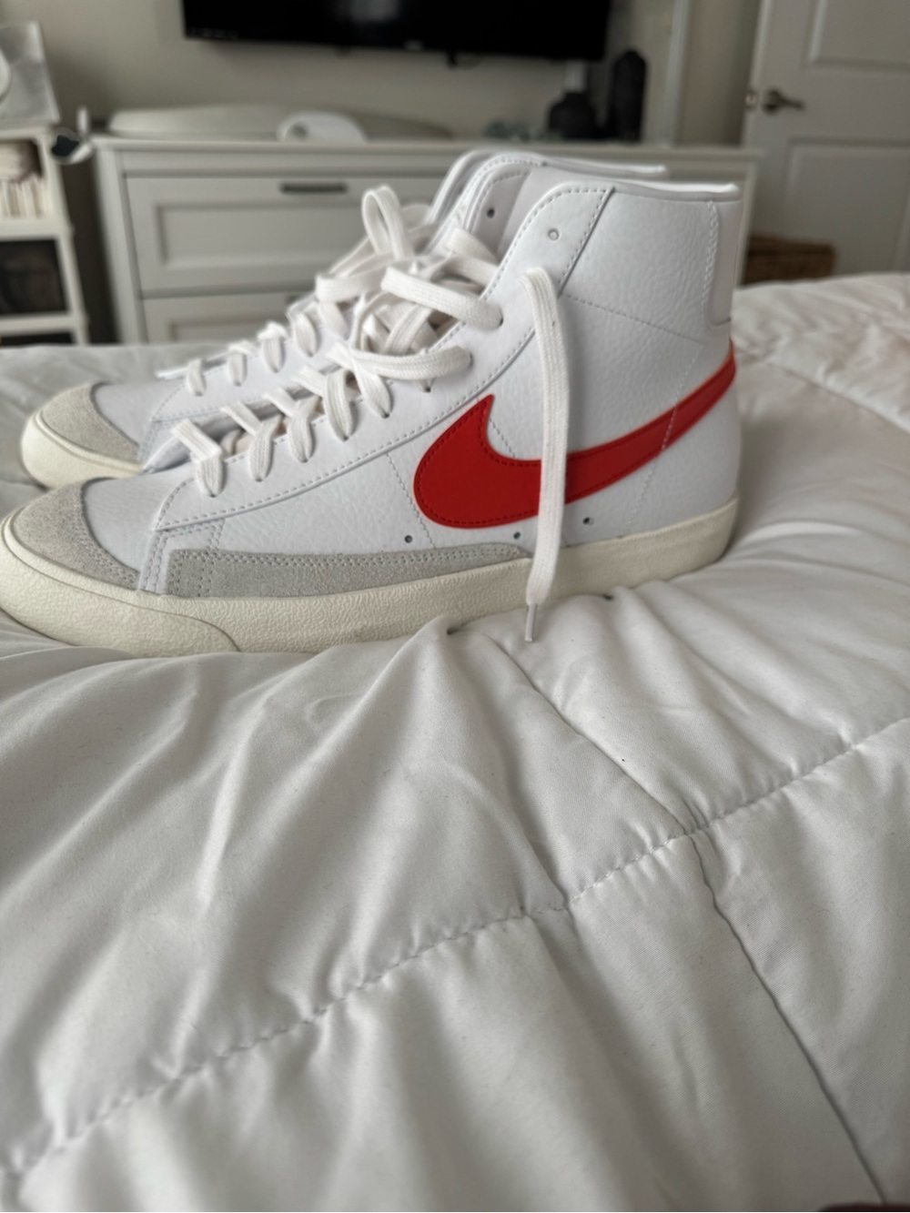 Nike High-Top Sneakers in White with Orange Swoosh